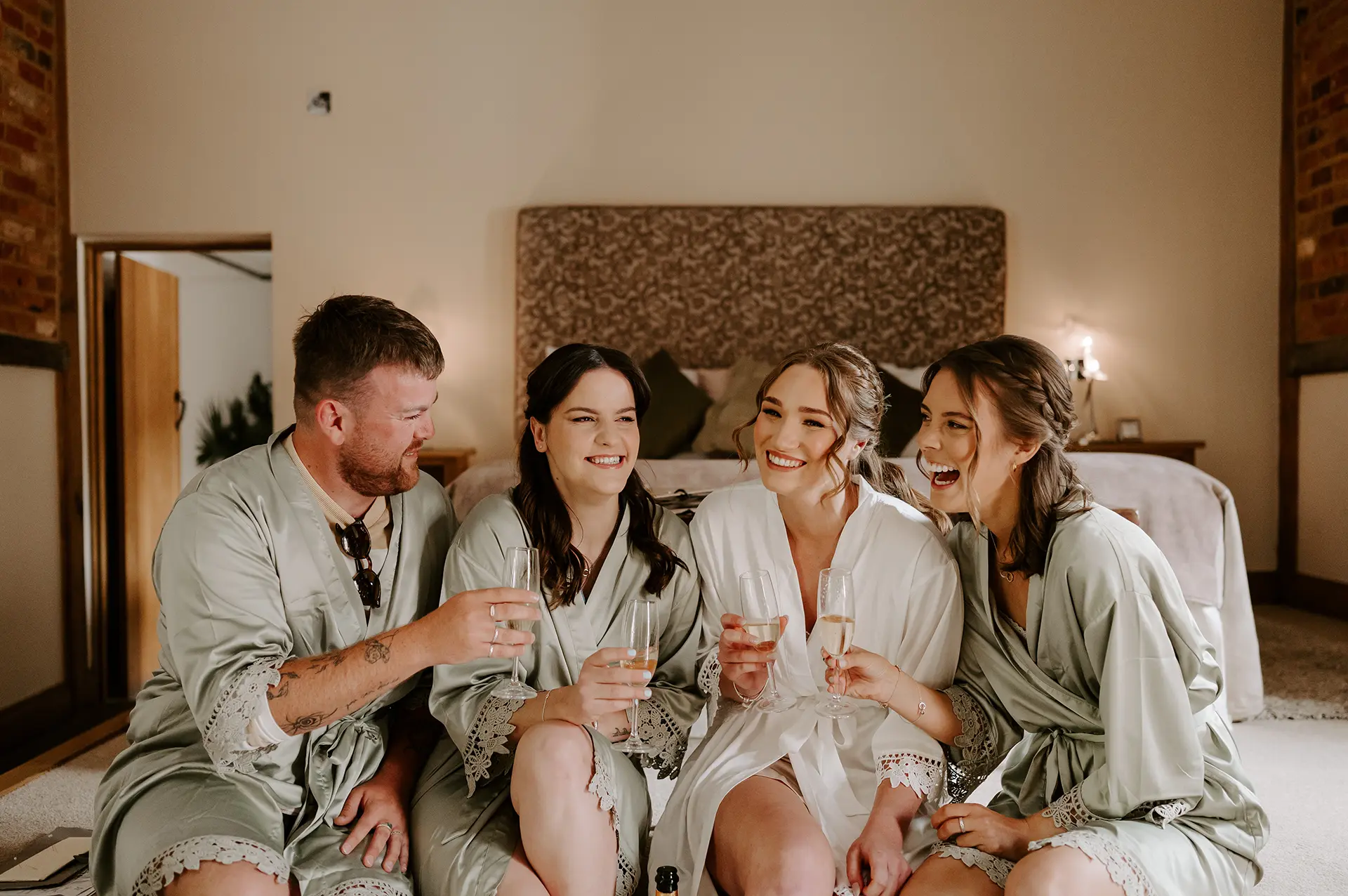 Wedding party getting ready in Rivervale Barn's honeymoon suite, the Cornstore Cottage