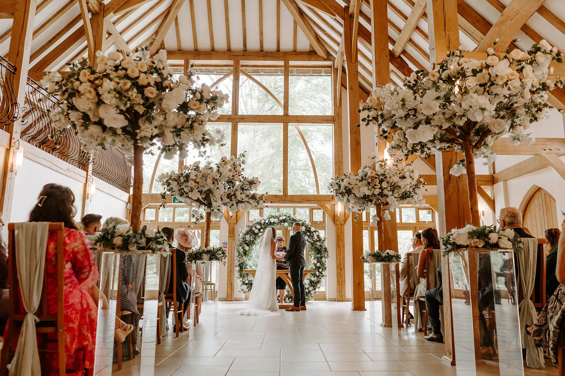A couple getting married in the Ceremony Barn at Rivervale Barn wedding venue