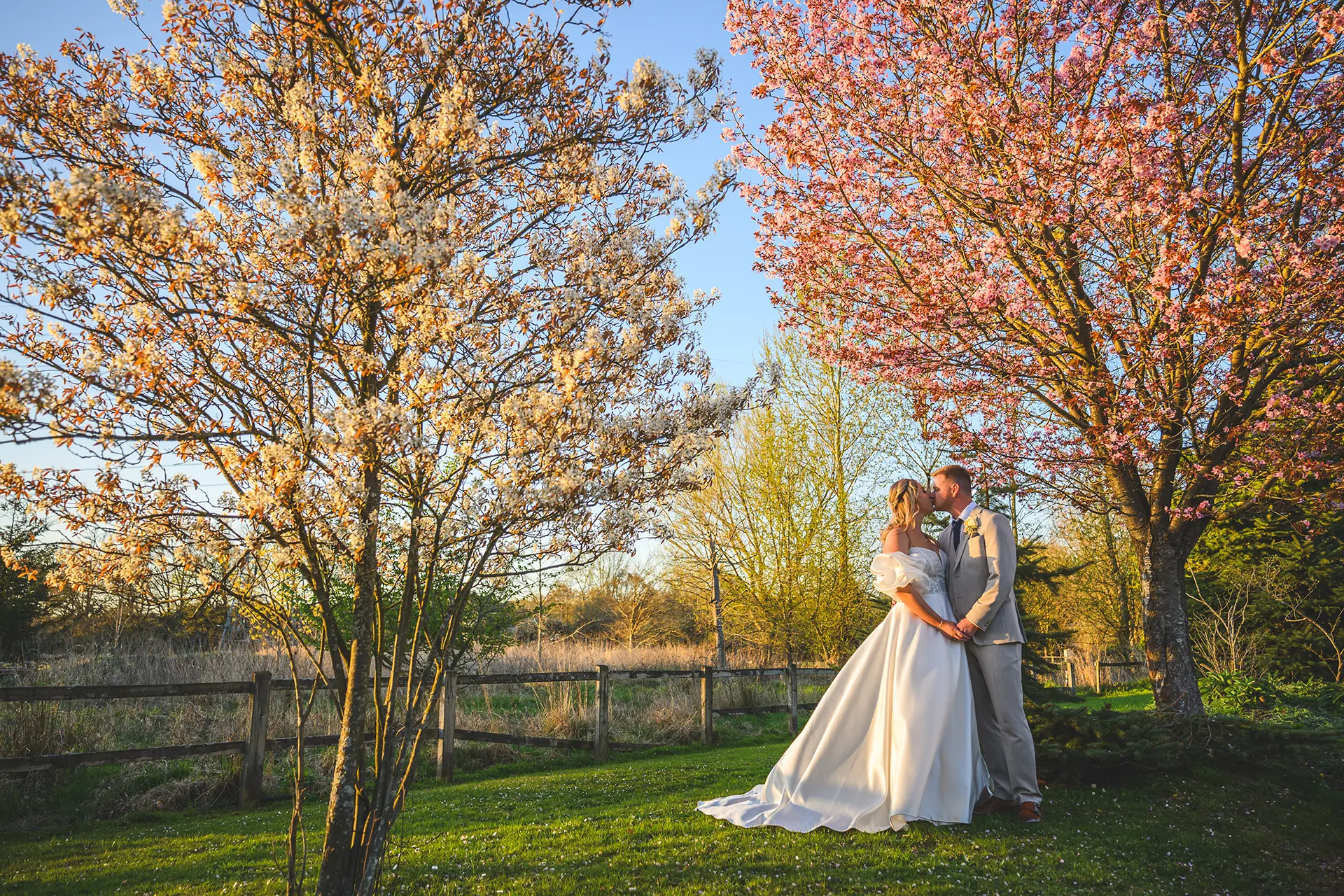 Couple having their wedding photos taken at Rivervale Barn in Spring