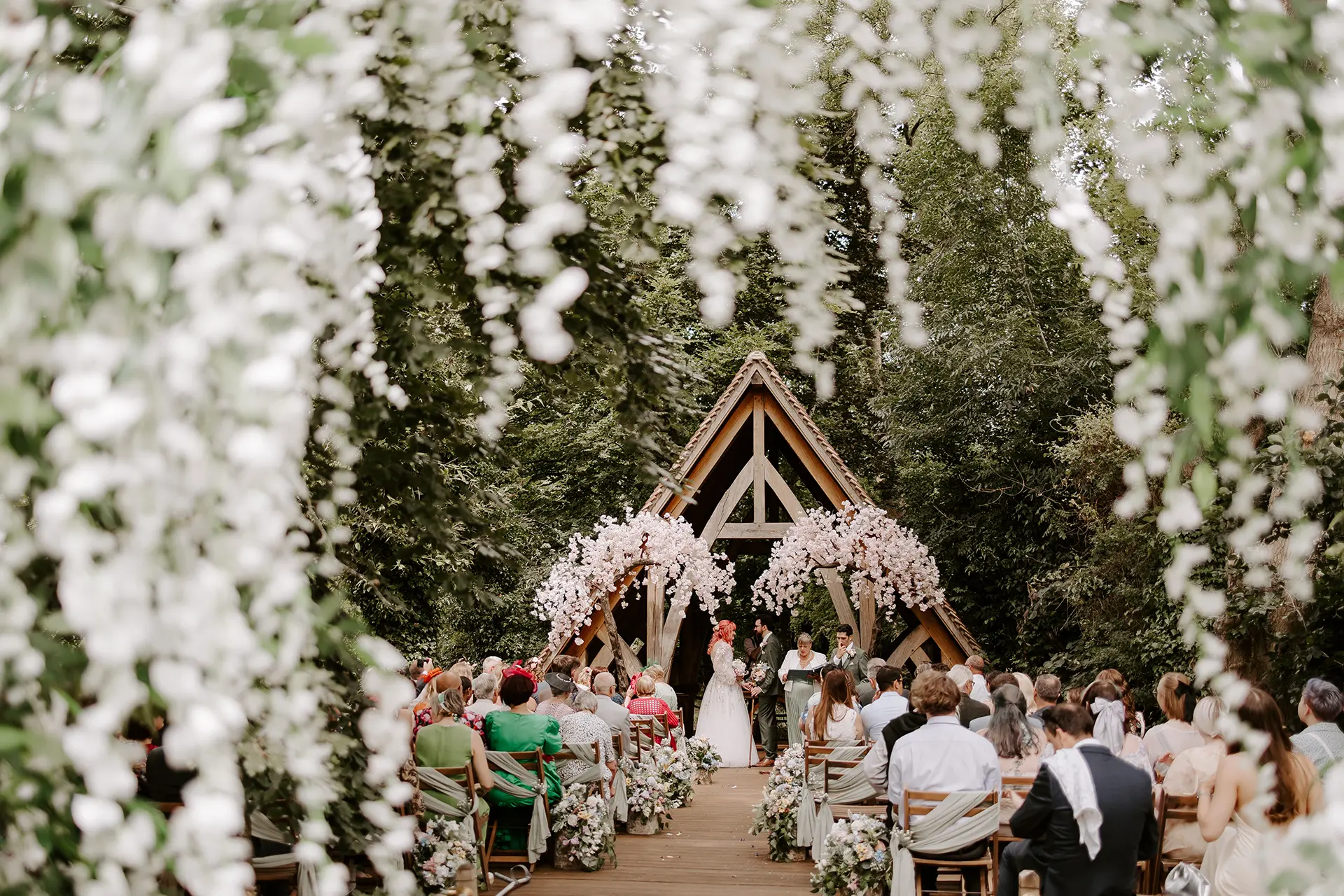 Outdoor wedding ceremony in the Spinney at Rivervale Barn