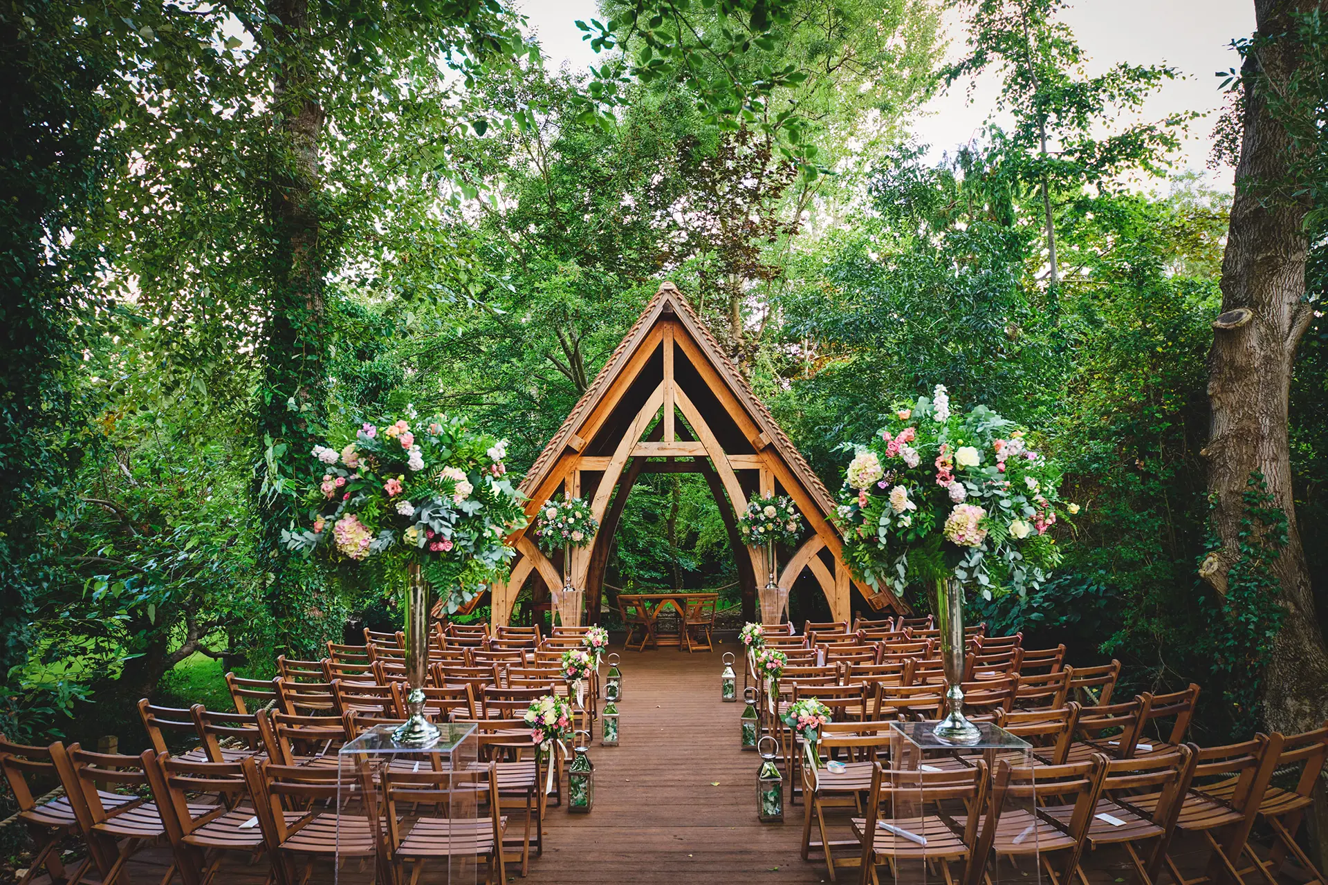The Spinney outdoor ceremony space set up for a wedding at Rivervale Barn