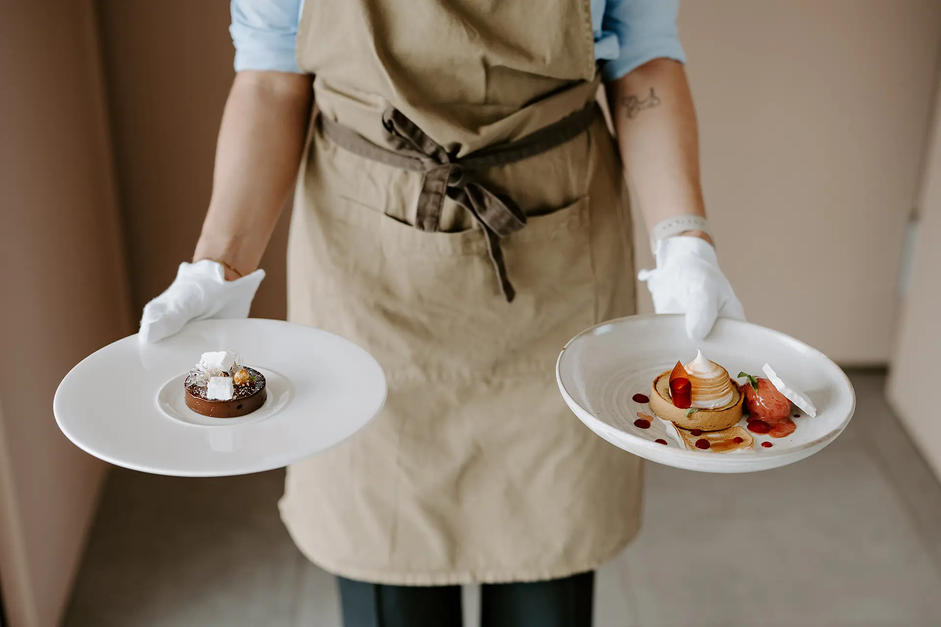 Waiting staff member serving food at a wedding at Rivervale Barn