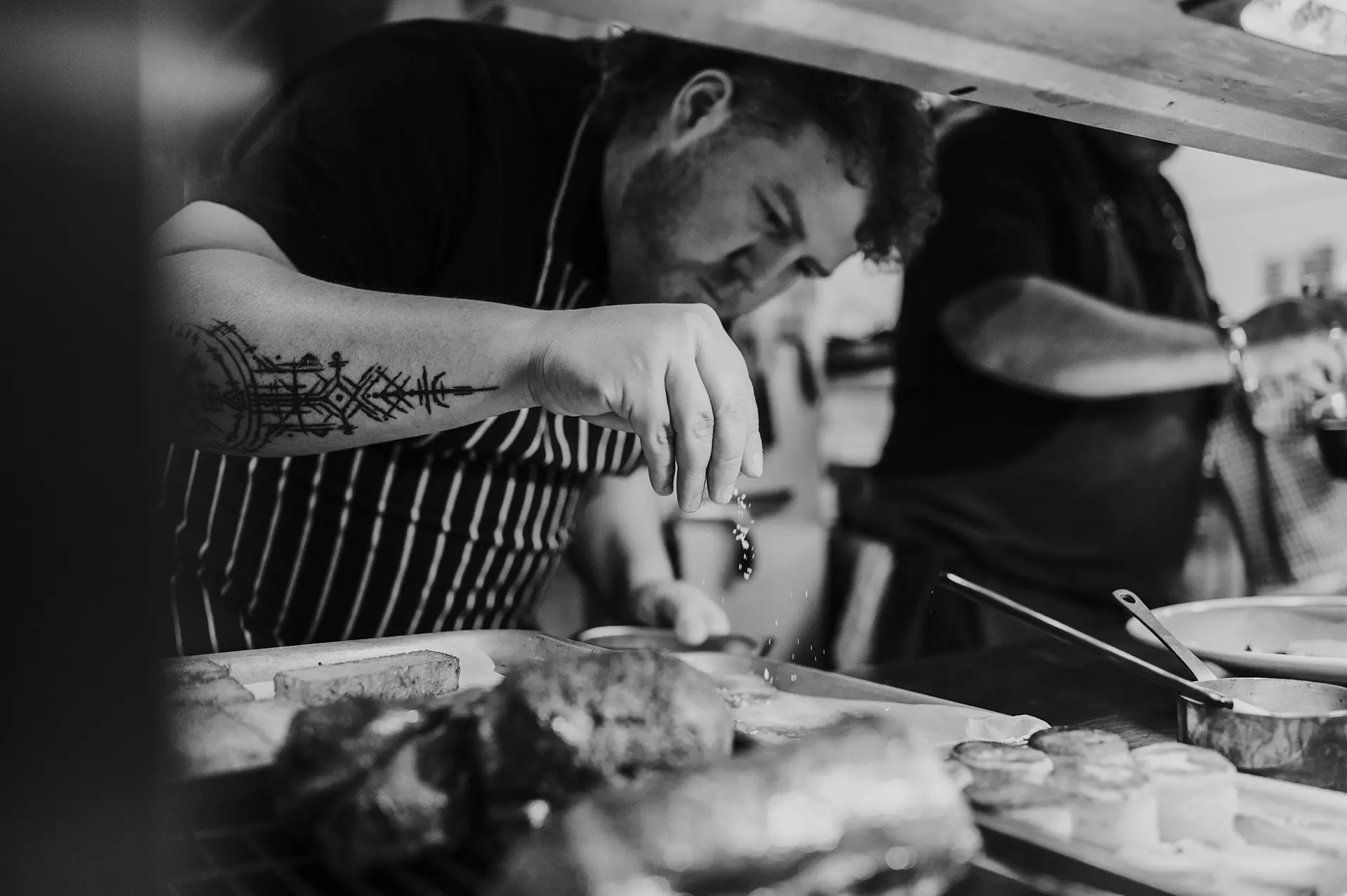 Chefs preparing food in the kitchen at Rivervale Barn