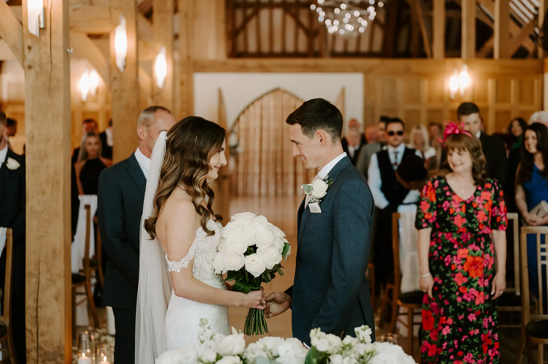 A couple getting married in the Ceremony Barn at Rivervale Barn