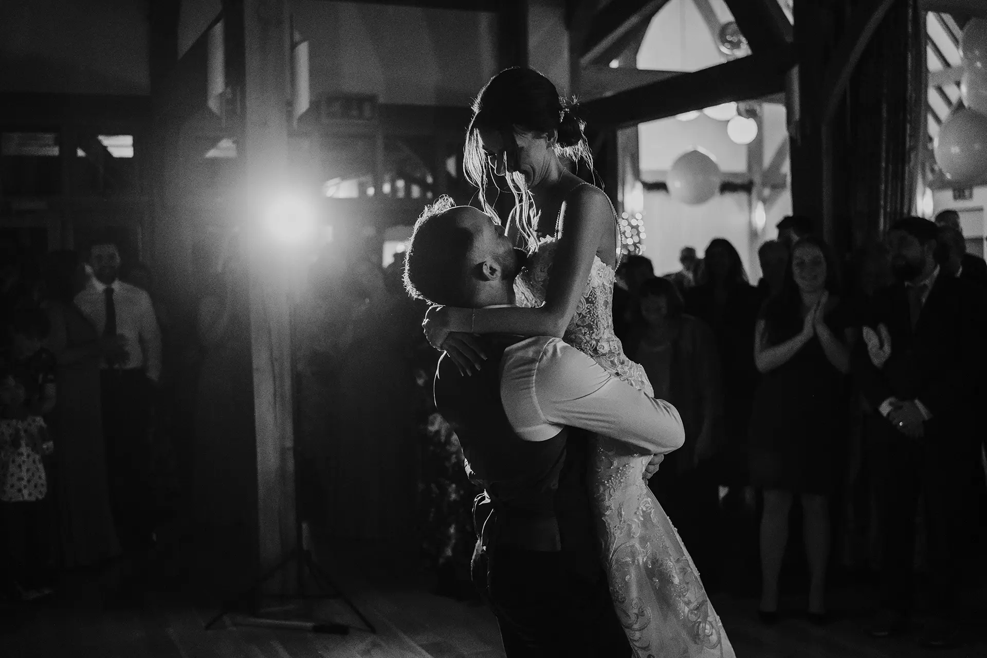 Couple having their first dance at the evening wedding reception at Rivervale Barn