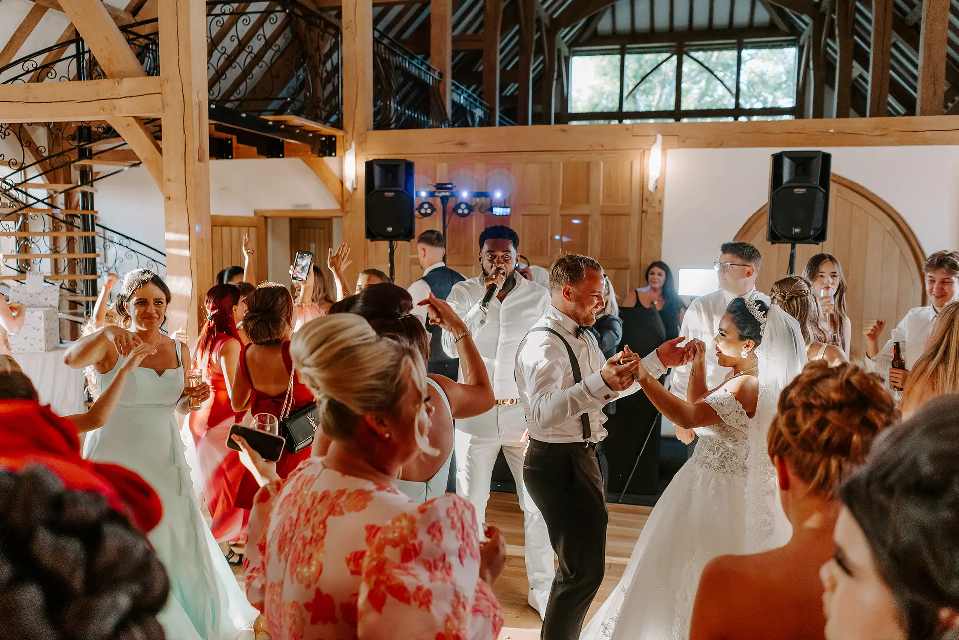 Wedding part guests dancing at the evening reception at Rivervale Barn