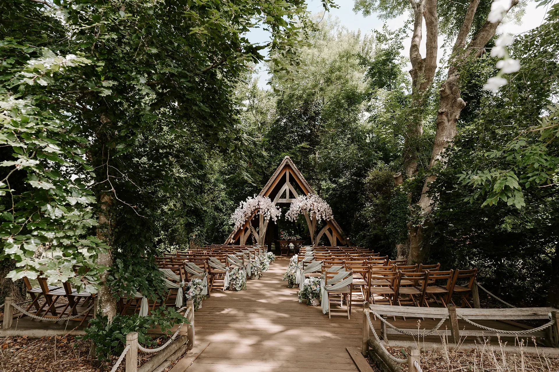 The Spinney outdoor ceremony space setup for a Spring wedding at Rivervale Barn
