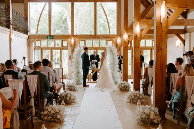 Bride and groom getting married in the Ceremony Barn at Rivervale Barn