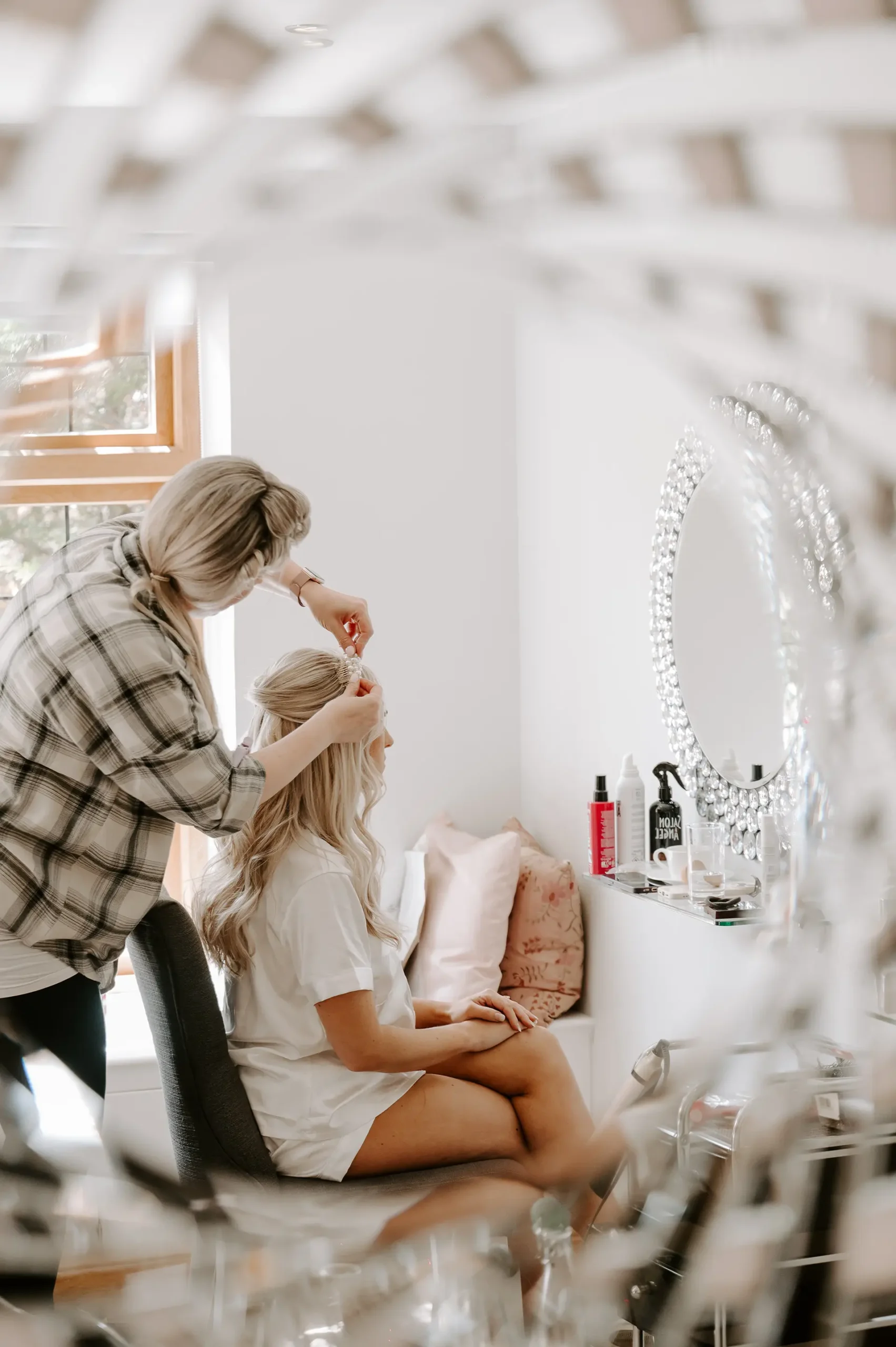 Bride getting her hair done in The Pamper Room at Rivervale Barn