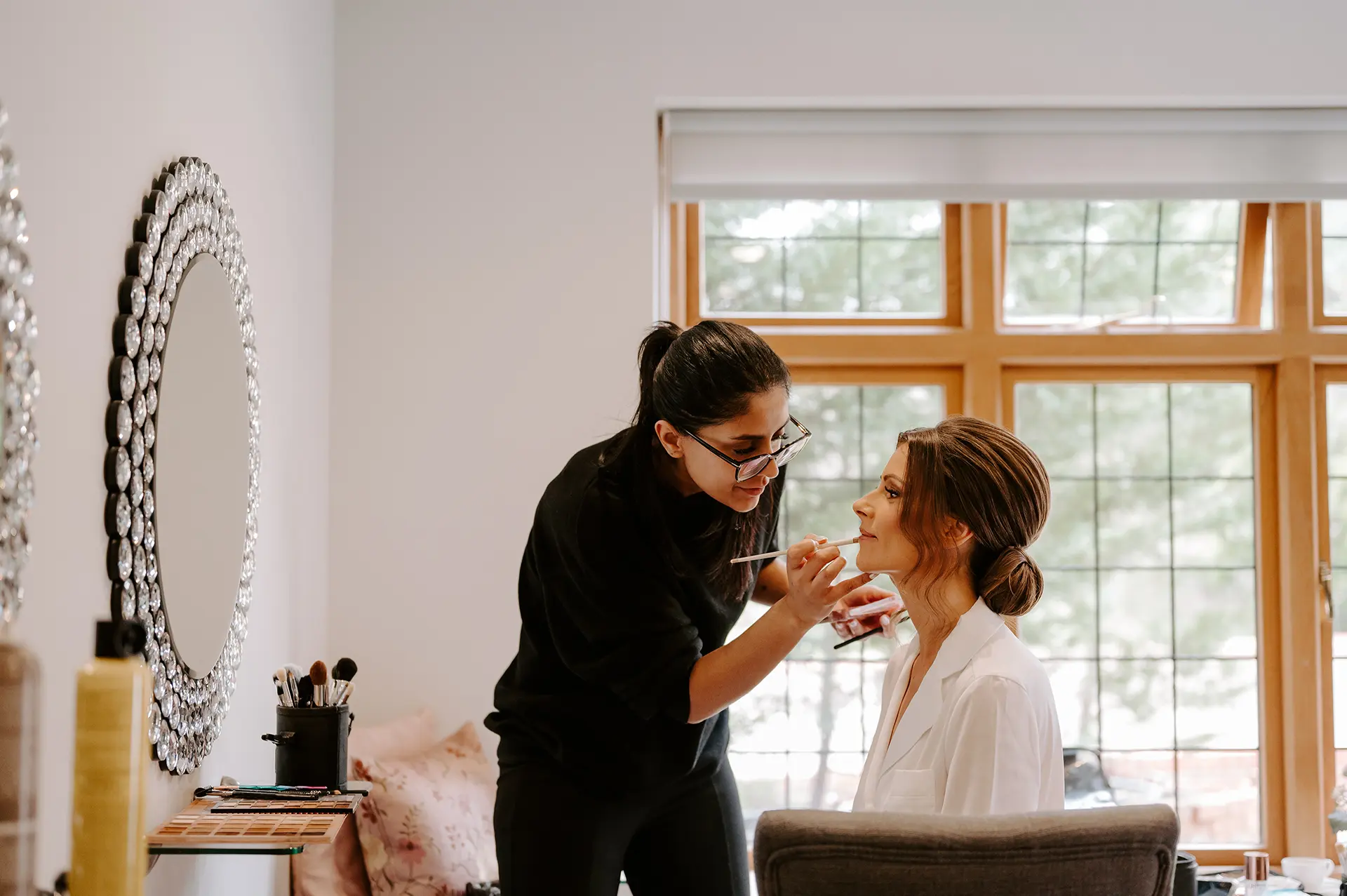 Bride getting ready in the Pamper Room at Rivervale Barn