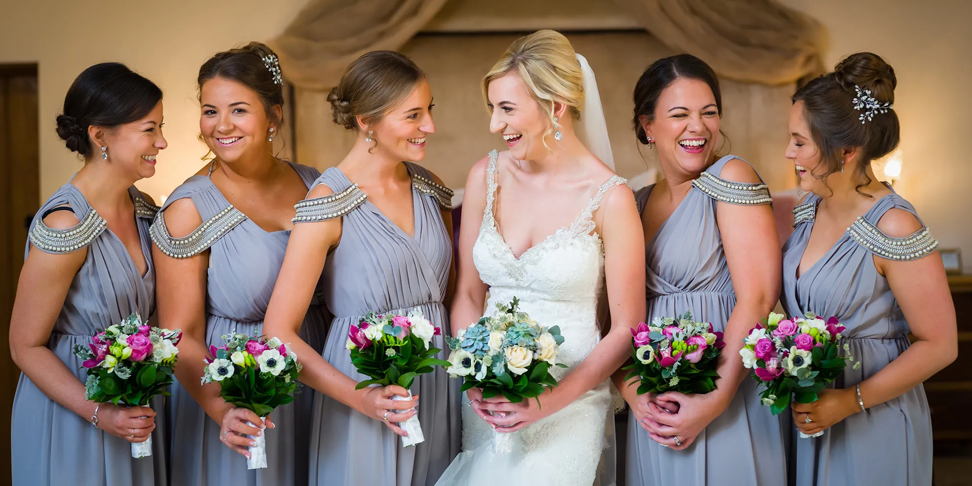 A bride and her bridesmaids ready for a stunning wedding in the beautiful barn venue Rivervale Barn