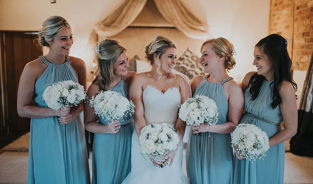 The blue bridesmaid dresses matched the Christmas wedding theme perfectly