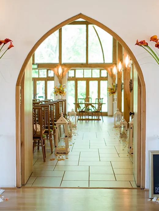 The Ceremony Barn was dressed with lanterns lining the aisle and accompanying scattered flower petals