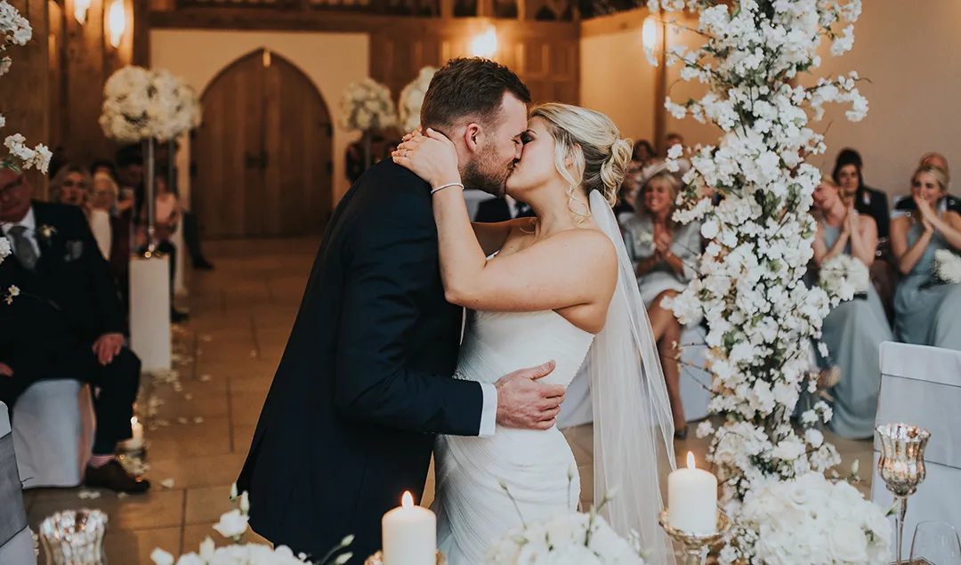 The bride and groom sealed their ceremony with a kiss at the beautiful Rivervale Barn