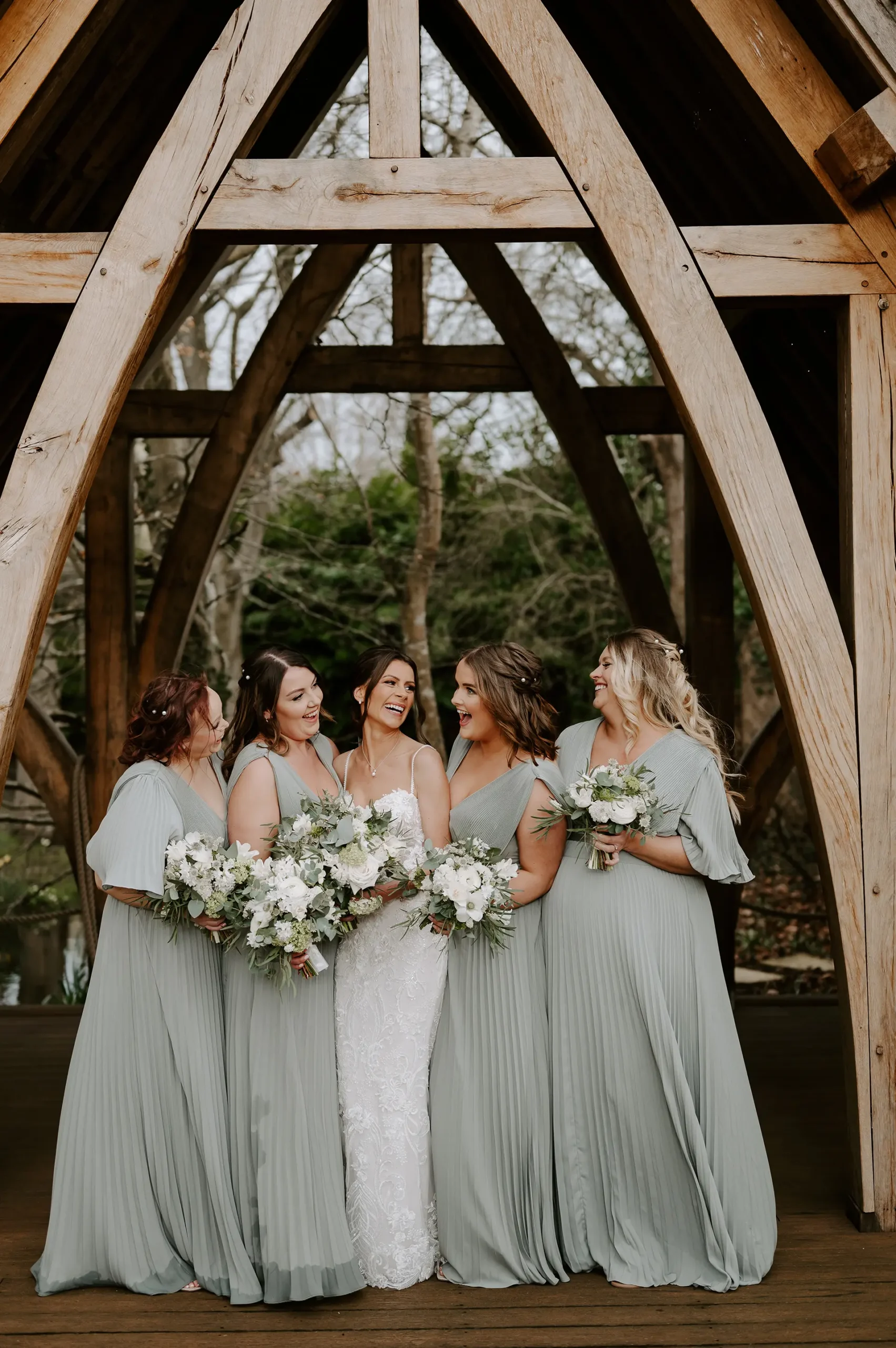 Bride and her bridesmaids at the Spinney at Rivervale Barn