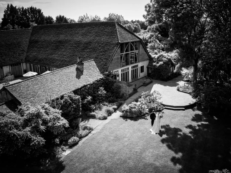 Couple walking through the gardens and grounds at Rivervale Barn