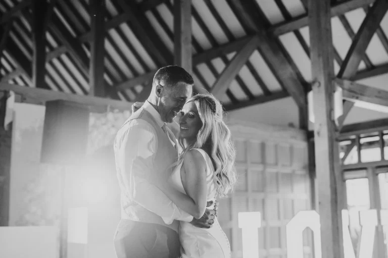 Couple having their first dance at a evening wedding reception at Riverale Barn