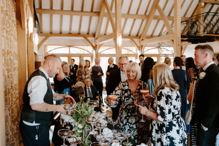 Cocktails being served from a pop-up bar at a wedding reception at Rivervale Barn