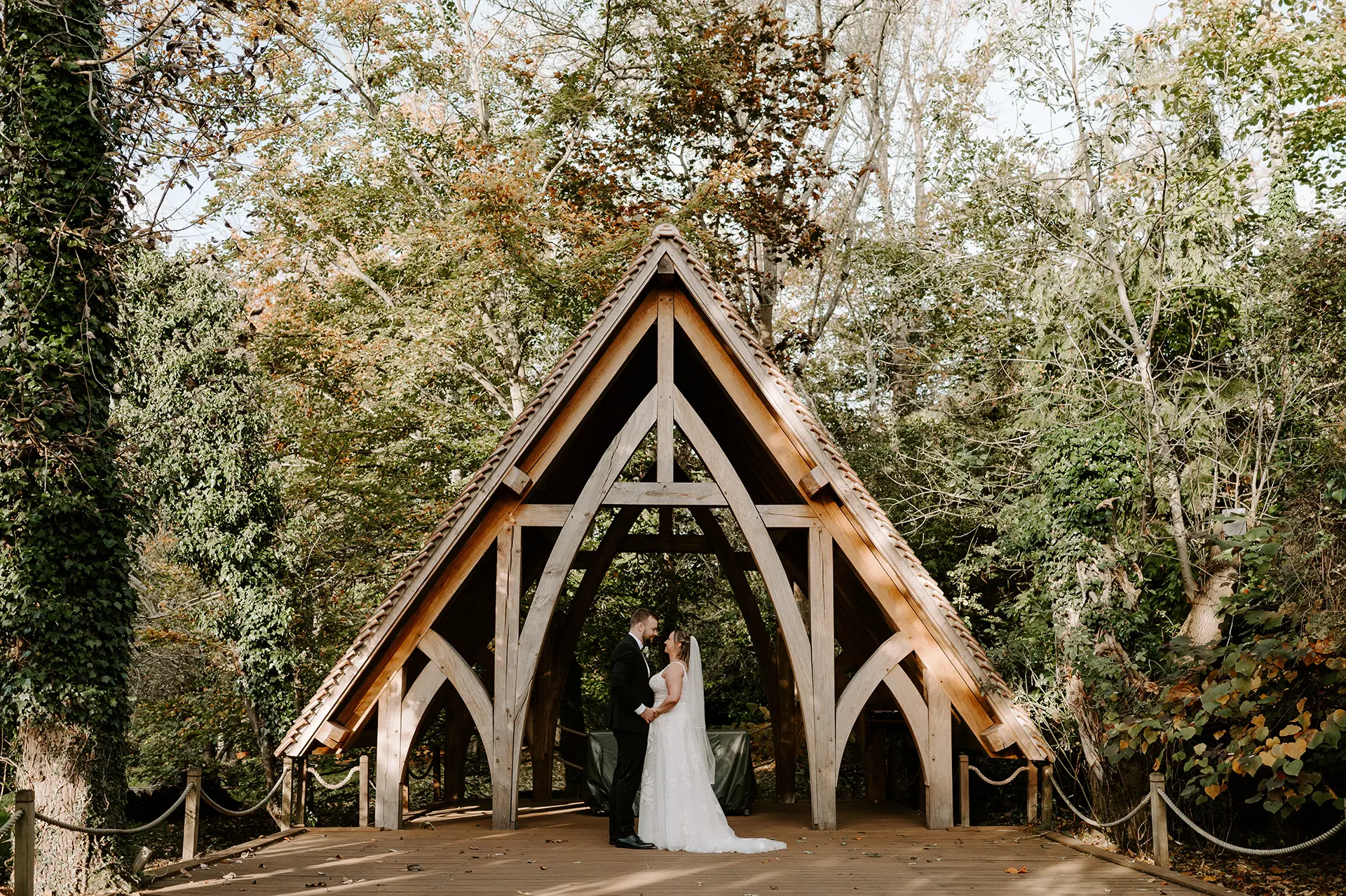 Bride and groom in the Spinney at Rivervale Barn in autumn