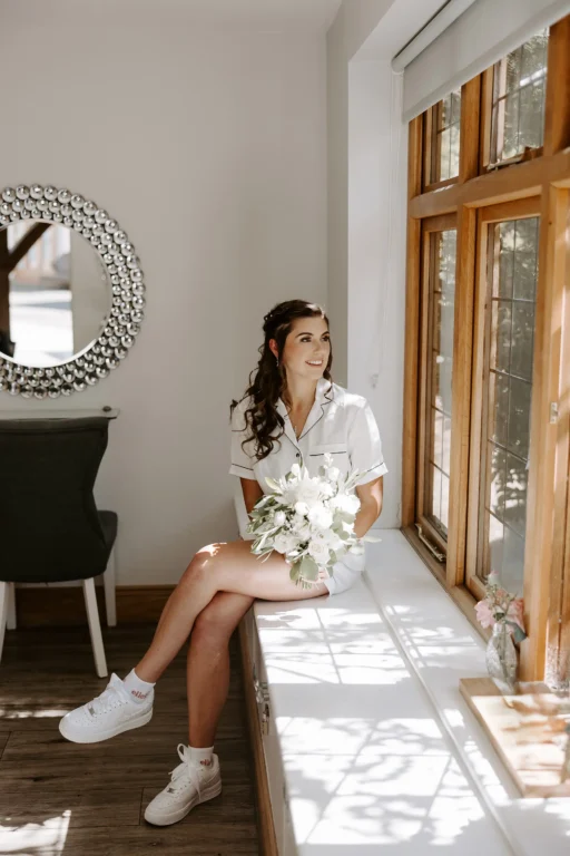 Bride getting ready for her wedding in The Pamper Room at Rivervale Barn