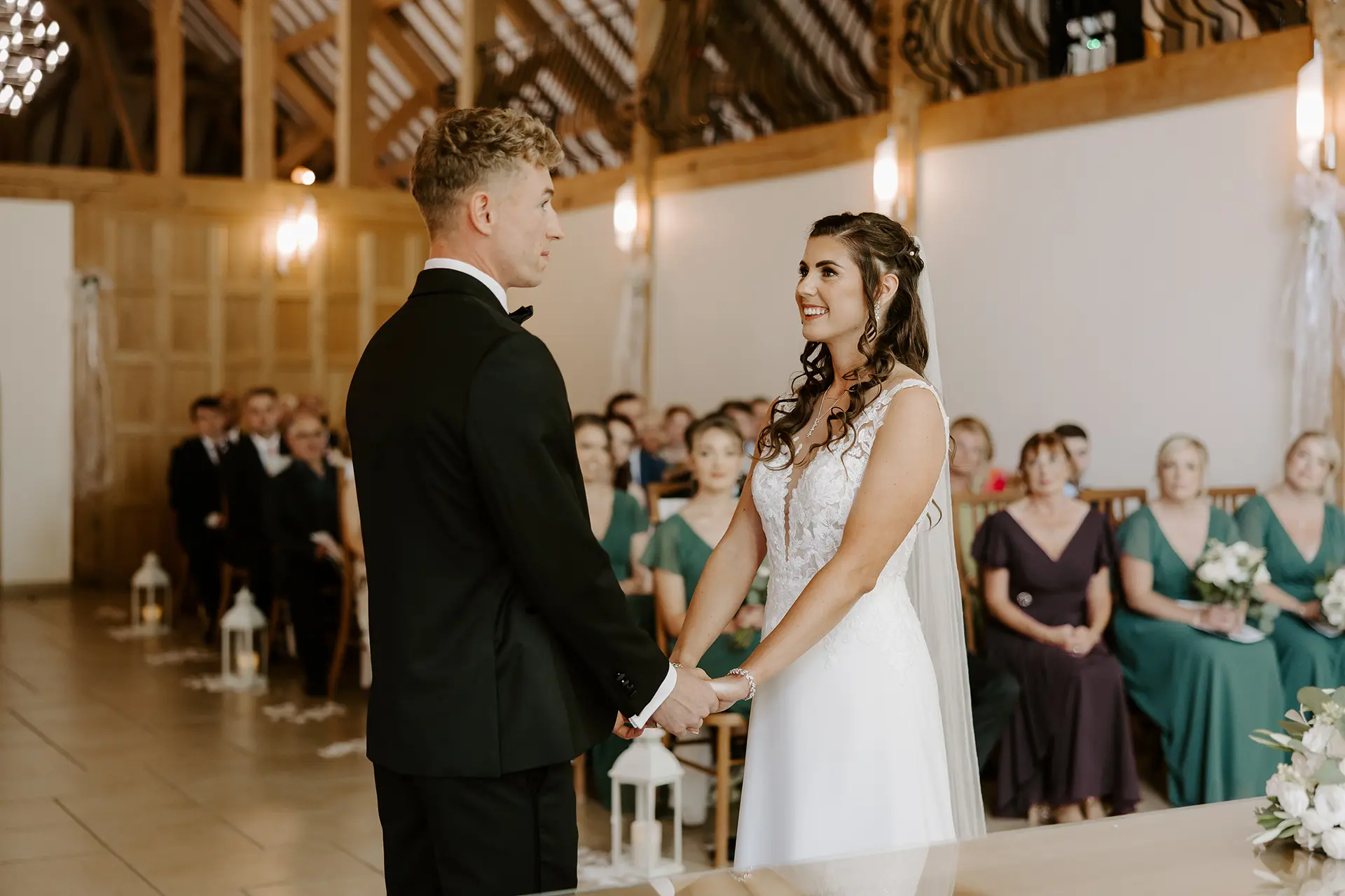 Bride and groom getting married in the Ceremony Barn at Rivervale Barn